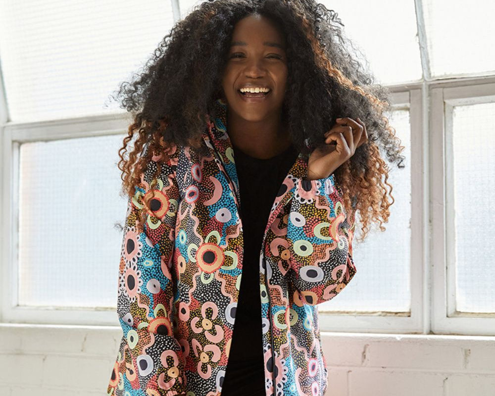 Woman wearing the Elements Jacket in Banksia Forest
